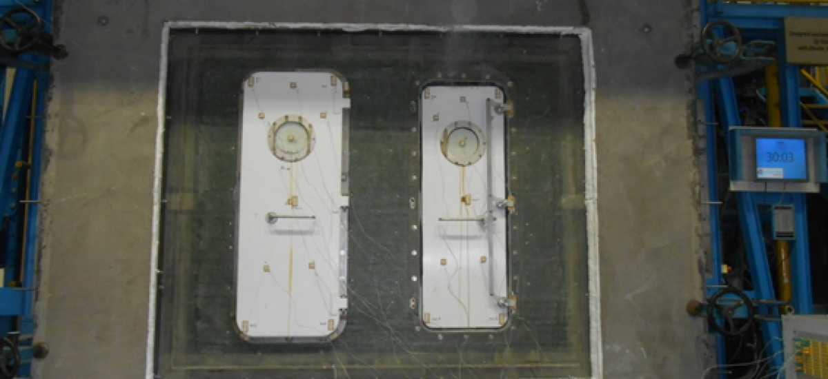 Fire test of a watertight door construction in a polyester bulkhead